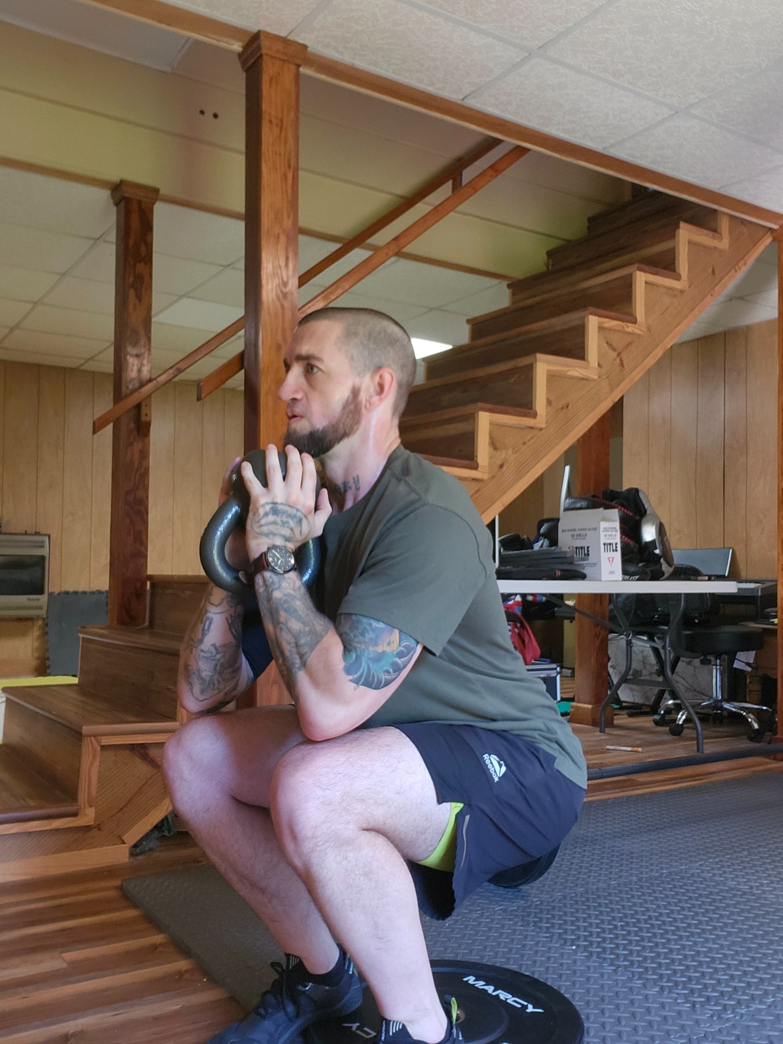 Fitness Buffs coach training with a kettlebell